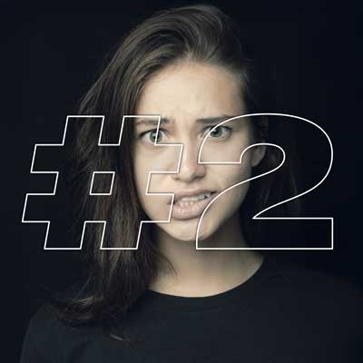 Shocked young woman with #2