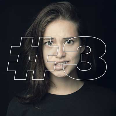 Shocked young woman with #3