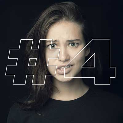Shocked young woman with #4