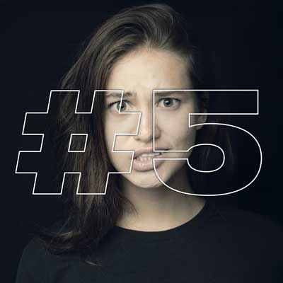Shocked young woman with #5
